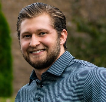 Portrait of Matt Reid, Team Manager